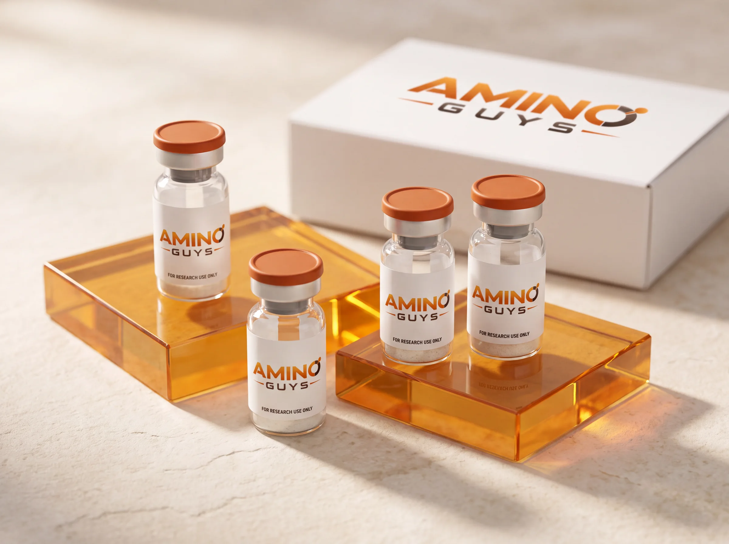 Amino Guys branded research vials on amber glass beside their white kit box