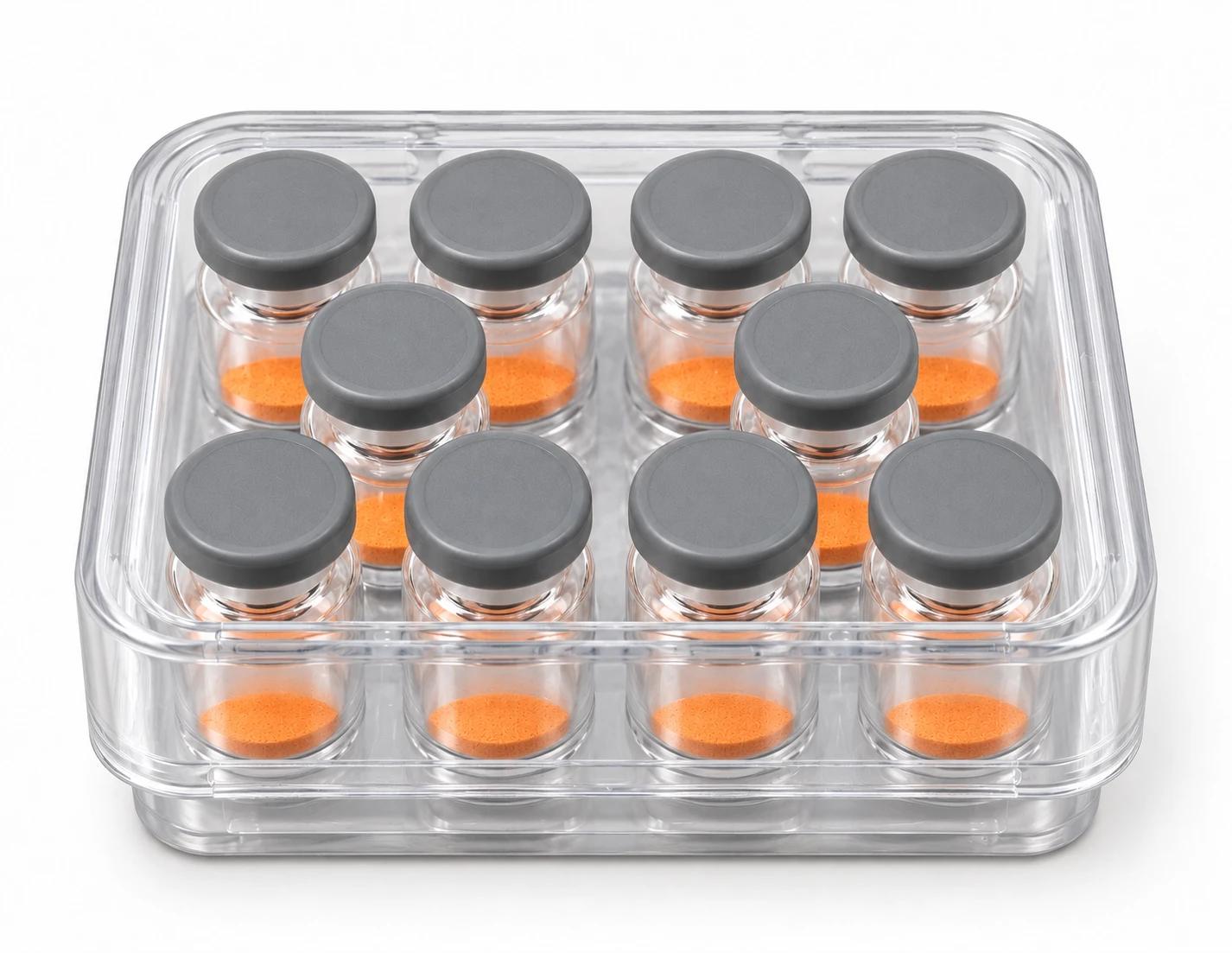 Packaging illustration: ten unlabelled glass vials with gray caps in a compact clear plastic kit case with its lid closed